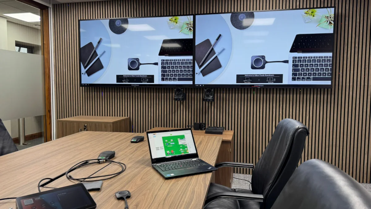 A boardroom with twin displays and video conferencing installed by AV Xpert for a Huntingdon business
