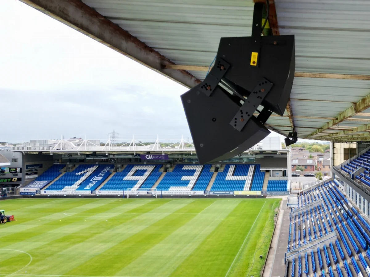 A stadium PA speaker under the stand roof at Peterborough United