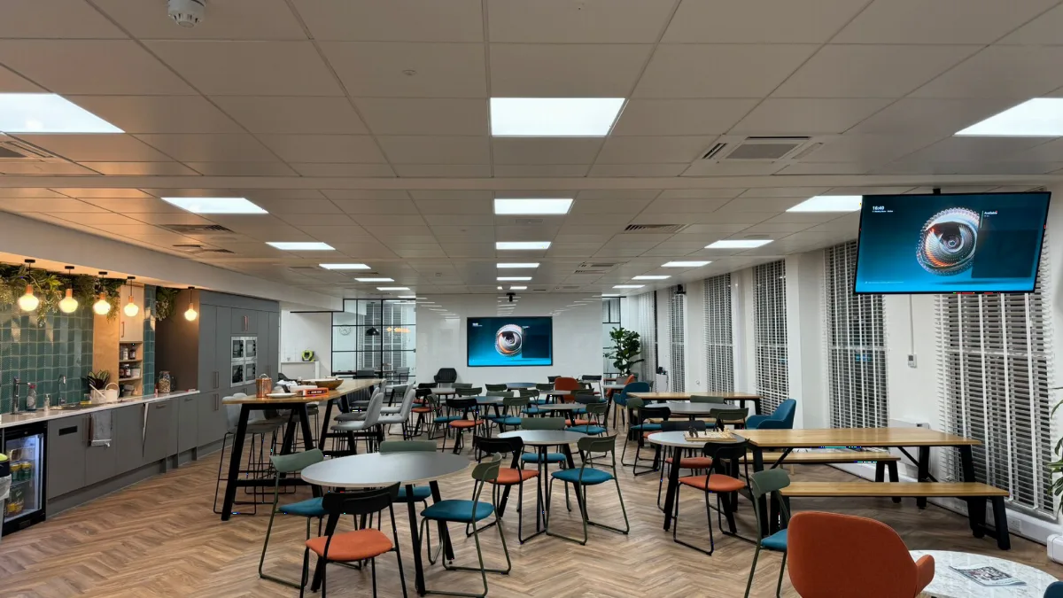 An open-plan multi-purpose space with screens and video conferencing equipment installed by AV Xpert in a central Cambridge office
