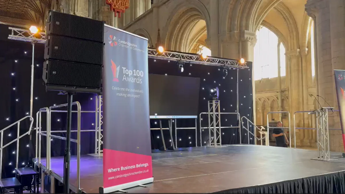 A line array beside the stage at the Cambridgeshire Chamber Top 100 Awards
