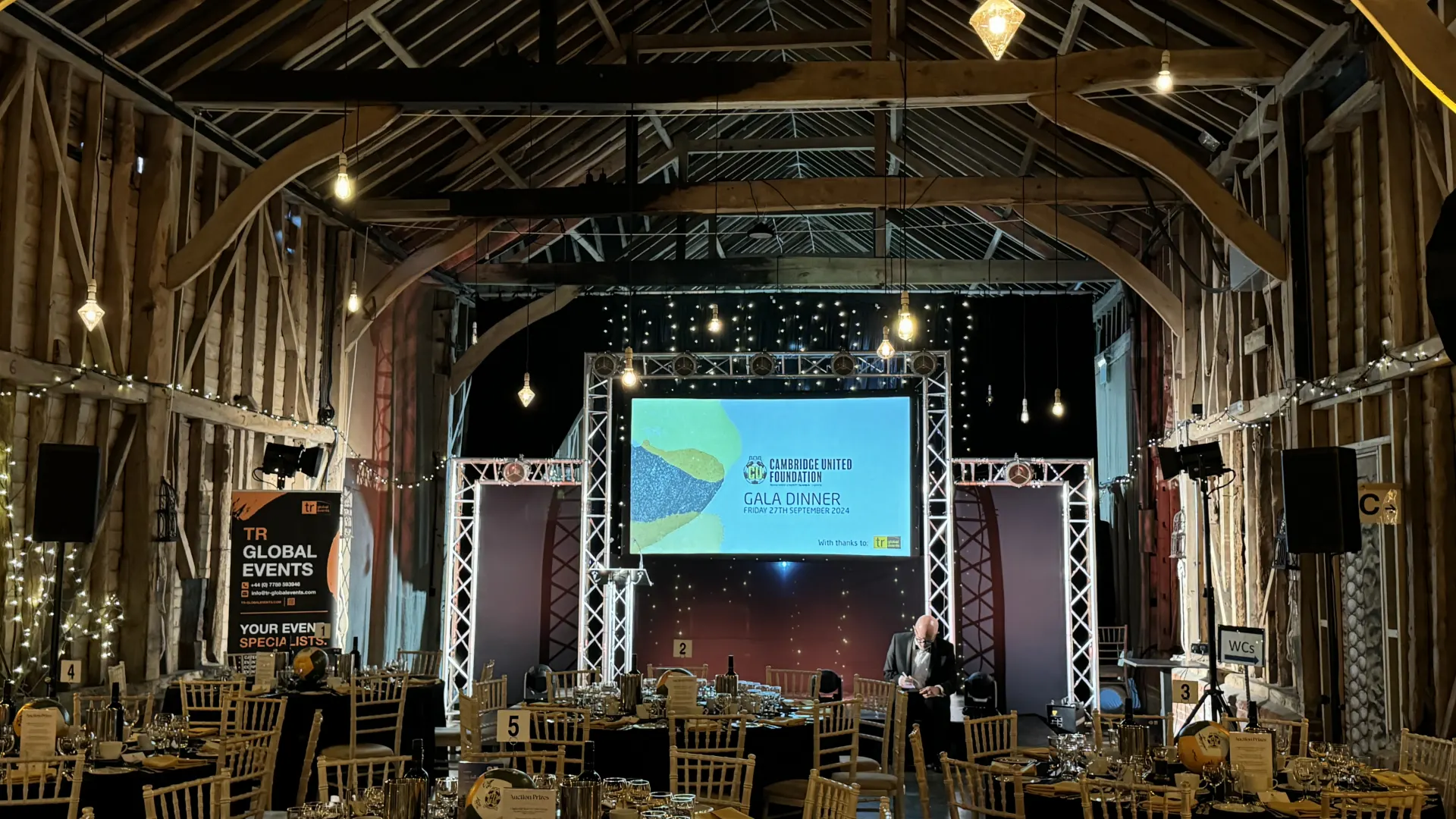 Full event production at a gala dinner in a barn at Childerley