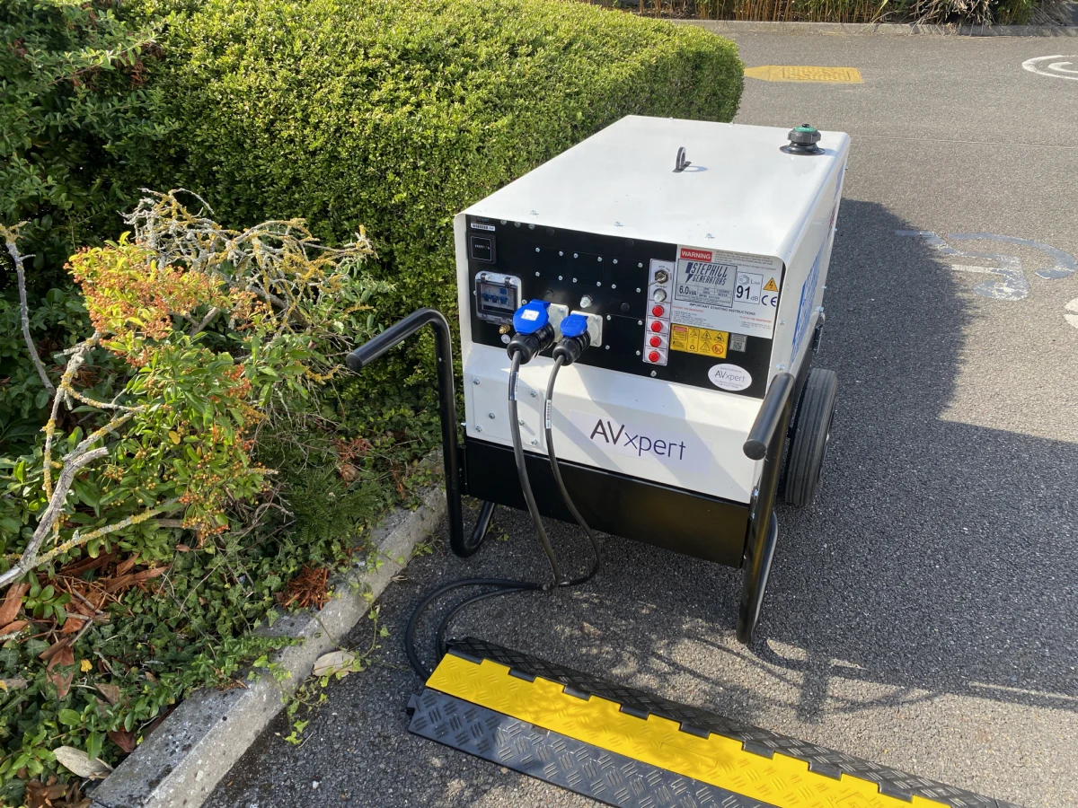 An AV Xpert generator with its cables run safely through a cable ramp