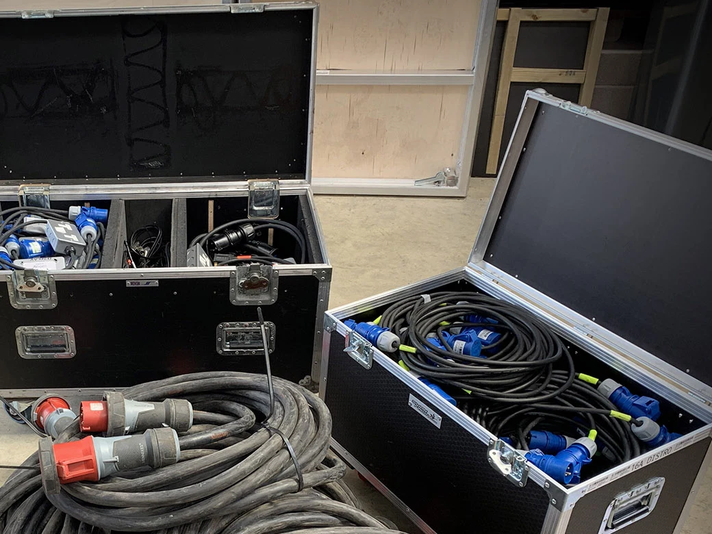 Power distribution boxes and cables packed in flight cases
