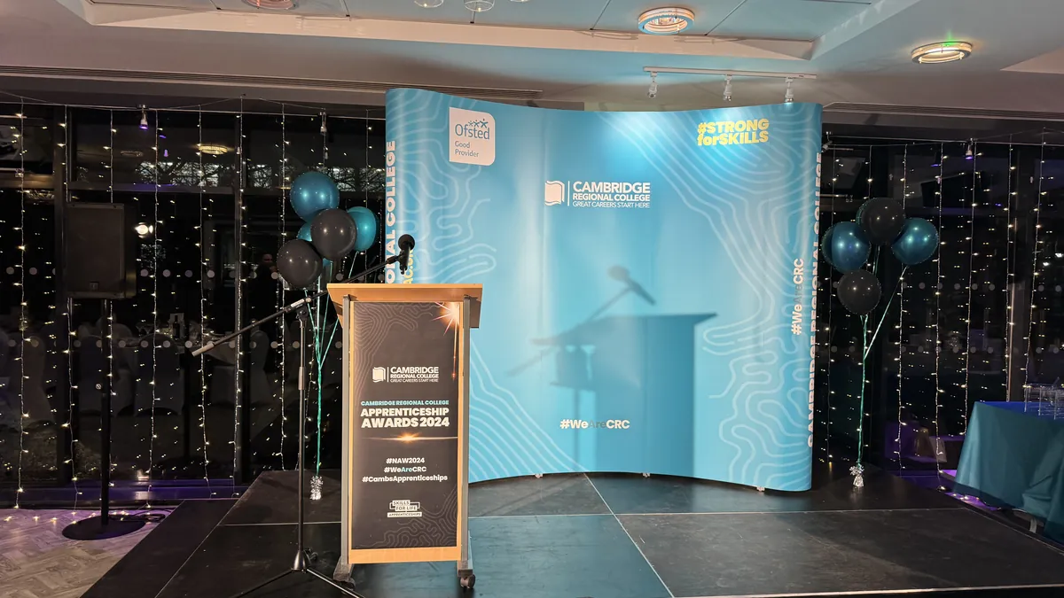 A stage set up by AV Xpert for an event at Cambridge Regional College