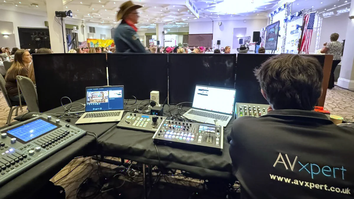 An AV Xpert technician running sound, lighting and video at the Family First event