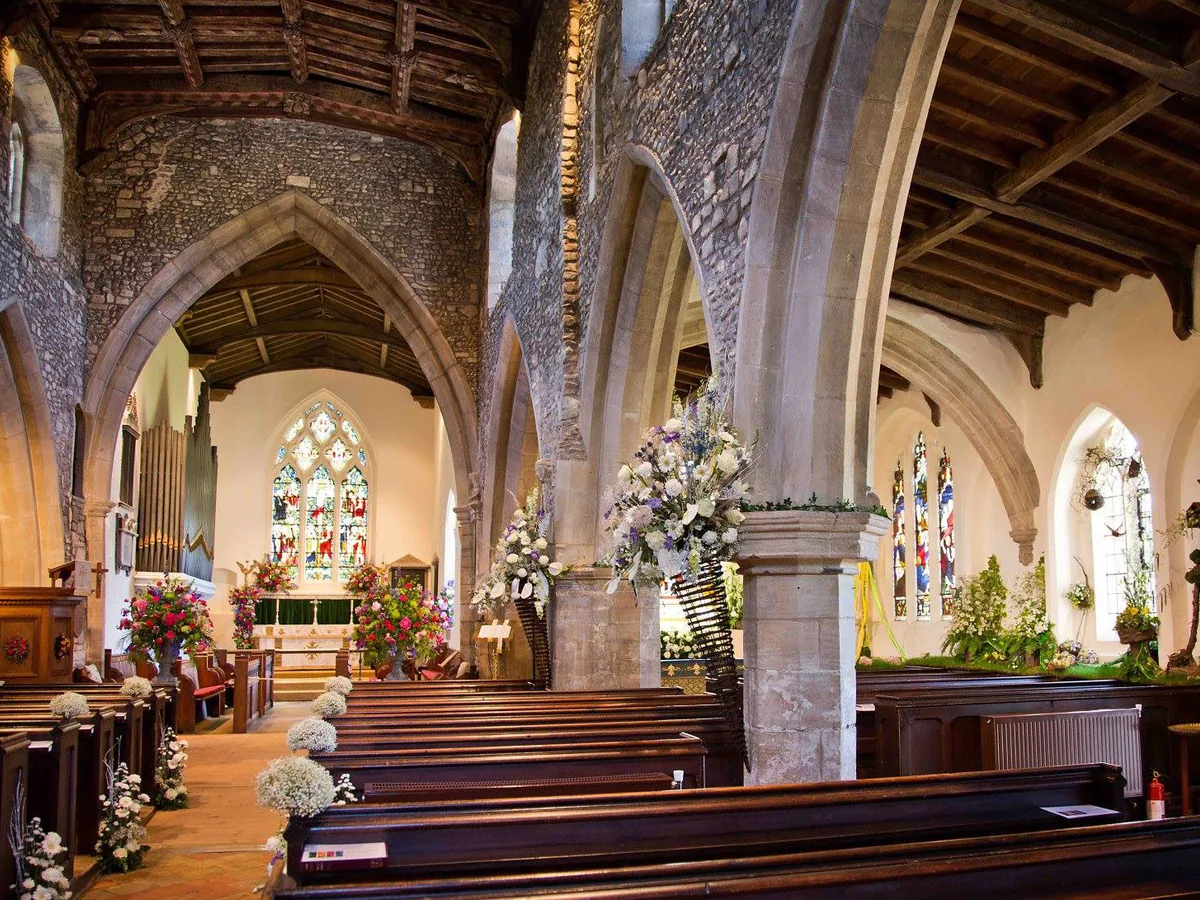 A quiet church filled with flowers