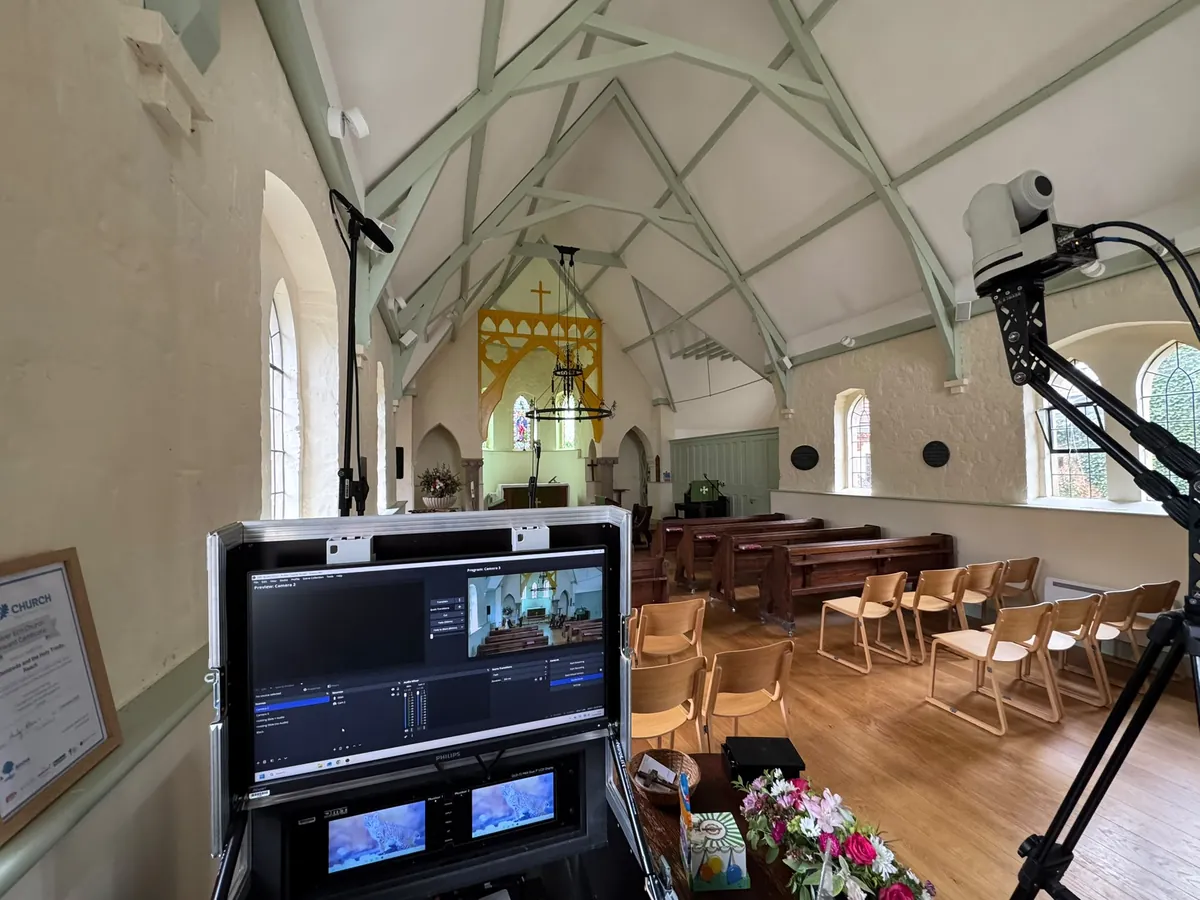 A live streaming station and remote camera set to one side of a church