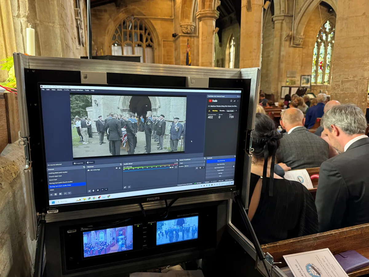 An AV Xpert live streaming station showing the stream beside the congregation at a funeral service