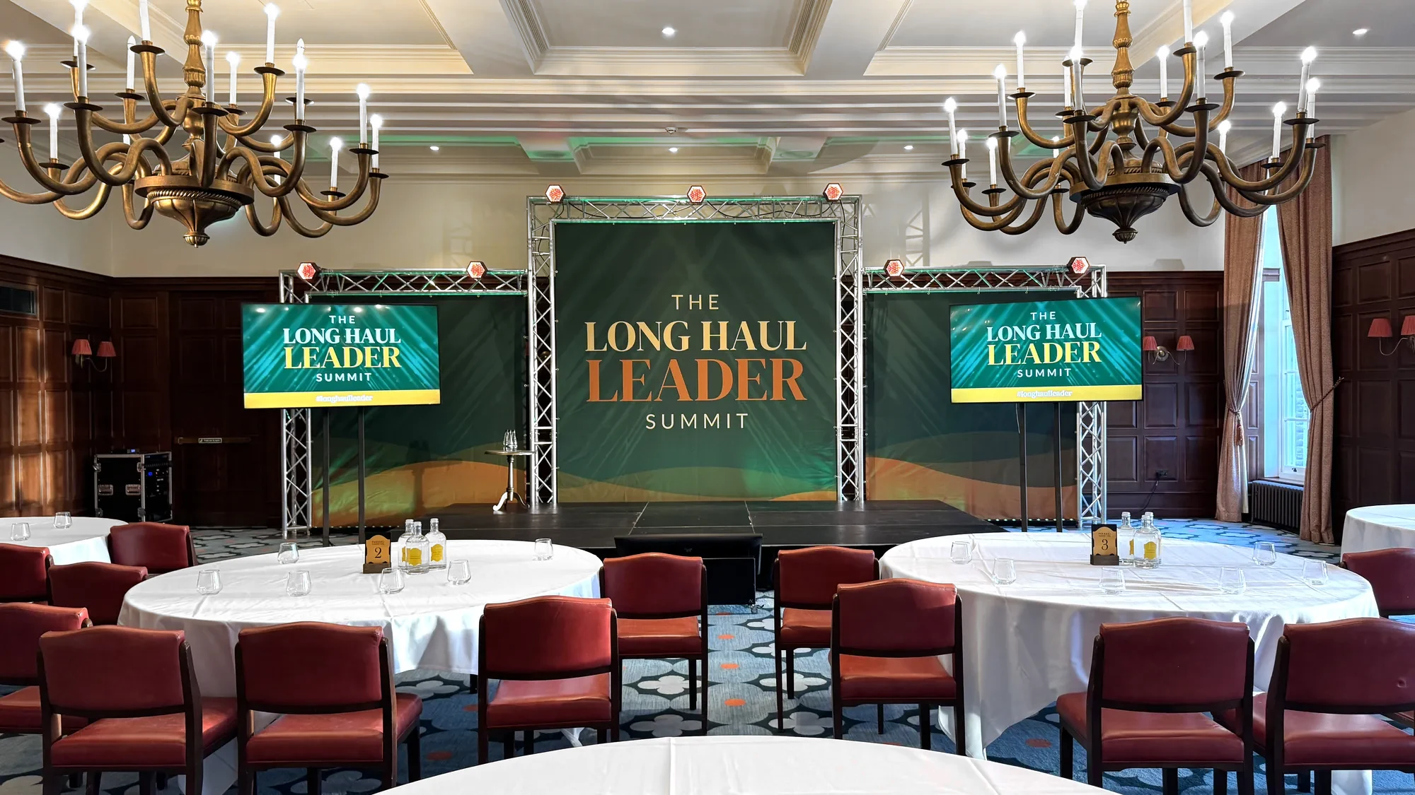 The branded stage set at the Long Haul Leader Summit