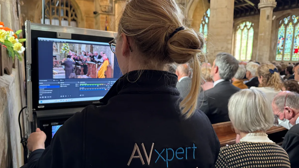 An AV Xpert technician running a live stream mixing desk during an event