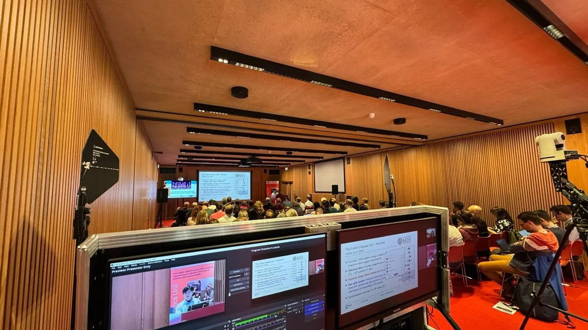 Screens and streaming equipment set up for a live event