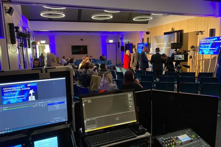 An AV Xpert technician at the front of house desk