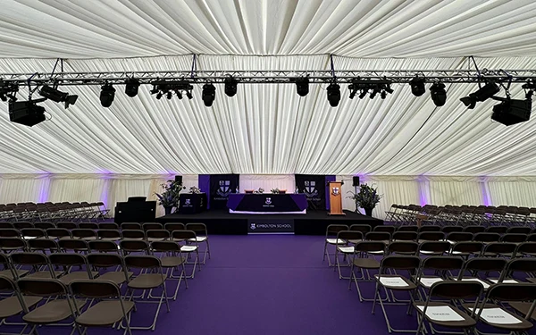 Stage with suspended lighting gantry above for school speech day