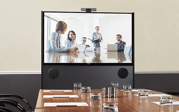 Mobile video conference unit at end of boardroom table